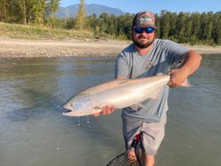 A person fishing in the scenic BC landscape