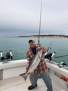 Angler with a 24-inch fish in Manistee