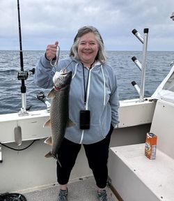 1 fisherman reeling in a big catch in MI