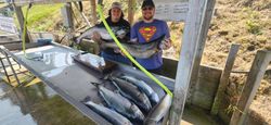Two people fishing in MI