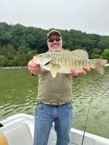 Angler with big fish in MI