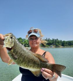 Angler with big fish caught while fishing in MI