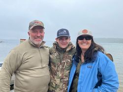 Three people enjoying a fishing trip in Kaleva