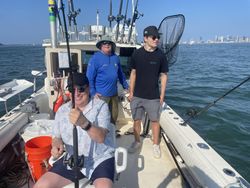Three people enjoying a fishing tour in Hingham
