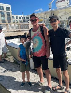 A group of 4 people enjoying a fishing tour in MA