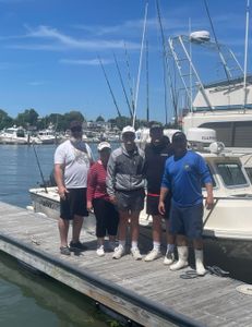 Four people enjoying a fishing tour in Hingham