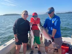 Two striped bass caught during fishing tours in Hingham