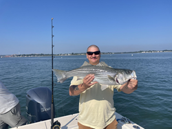Reeling in a good catch on a beautiful day.
