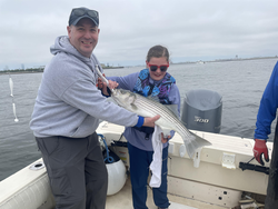 A striped bass caught using a variety of techniques in the beautiful Boston area.