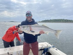 Reeled in this big striped bass with some slick techniques in Boston!