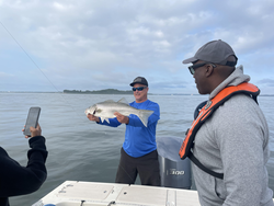 Reeled in a feisty striped bass in the bustling city of Boston!