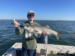 Nice striped bass caught using deep sea jigging and trolling techniques in clear conditions!