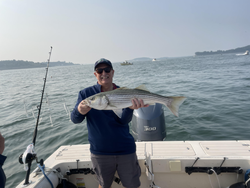 Huge 27-inch Striped Bass landed while deep sea jigging off Hingham!