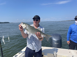Big Striped Bass reeled in on a crystal clear day!