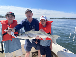 Huge 31-inch Striped Bass hooked during an epic Deep Sea adventure!