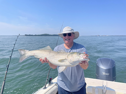 Big Striped Bass landed during a partly cloudy day of Deep Sea action!