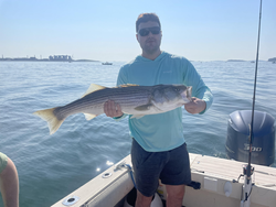 Striped Bass on the line at 18 Shipyard Dr - storms brewing for an epic battle!