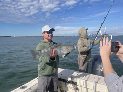 Nice striped bass caught using jigging and trolling in partly cloudy conditions!