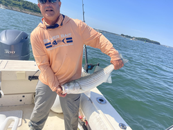Huge 28-inch Striped Bass hooked in Hingham's clear waters!