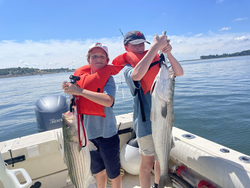 Huge striped bass caught deep sea fishing off Hingham - what a day!