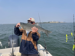 Striped Bass action in Hingham under partly cloudy skies!