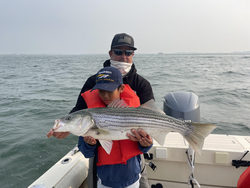 Huge 31-inch Striped Bass reeled in during an epic Deep Sea adventure!