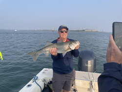 Big Striped Bass landed on a perfect day for deep sea jigging!