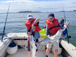 Big Striped Bass landed during a stormy afternoon in Hingham!