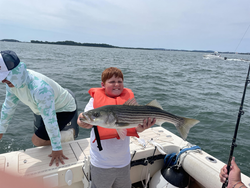 Big Striped Bass reeled in during a partly cloudy day in Hingham!