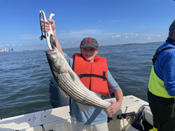 Striped Bass success with some afternoon clearing and storm drama!