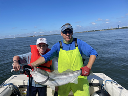 Big Striped Bass landed during a stormy afternoon!