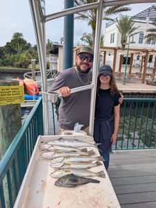 Two people fishing for 3 Spanish Mackerel and Spotted Weakfish in Florida