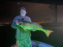 Angler with big fish caught in Milton