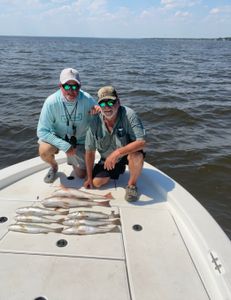 Two people fishing in Milton