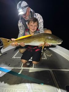Angler with a fishing rod on the shore in FL