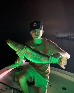 A fisherman with a 18-inch catch in Florida