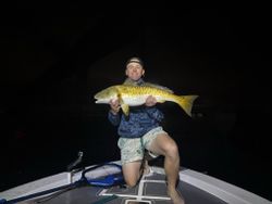 A person fishing for a redfish in Florida