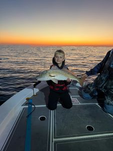 A person fishing for a single redfish in Florida