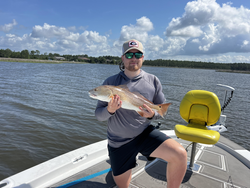 A fantastic catch of a beautiful 18-inch Redfish!