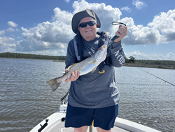 Battling the Spotted Weakfish on a partly cloudy day - a fishing adventure to remember!