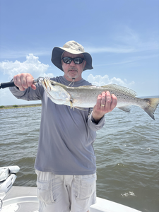 Hooked a spotted weakfish in the afternoon rain!