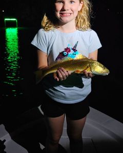 A solo fisherman in FL catches a 13-inch fish using a fishing technique.