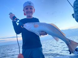 Angler holding a 25-inch fish in TX