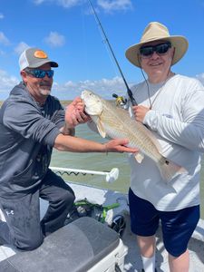 Anglers holding fishing rods in TX