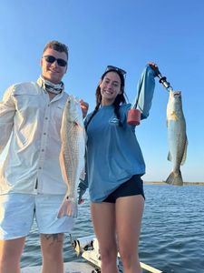Two anglers casting fishing lines in Texas