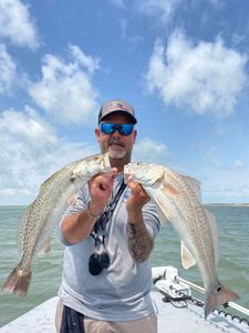 Two fish being caught in TX