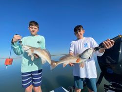 Two big redfish caught while fishing in Pleasanton