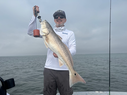 Beautiful Rockport redfish hauled up from the depths!
