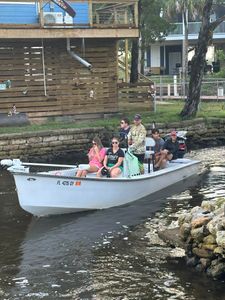 Group of 6 people fishing on beach in FL