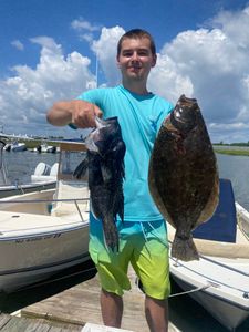 Two summer flounder and sea bass caught while fishing in Barnegat Light, New Jersey